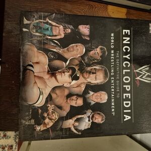 WWE Encyclopedia with Black and White Cover i also have legends of her wrestling